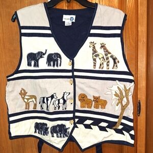A Paul Harris Design vest with a Safari animal print on front in a size XL.